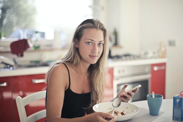 A woman having breakfast.