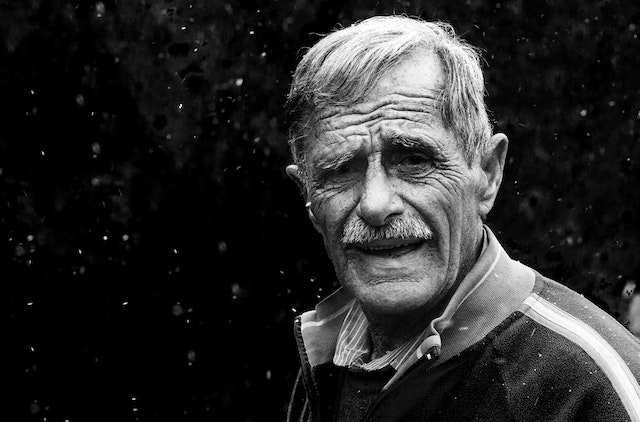A black and white portrait of an old man. 