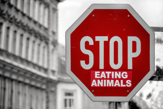 A stop sign transformed into a call for stopping animal consumption