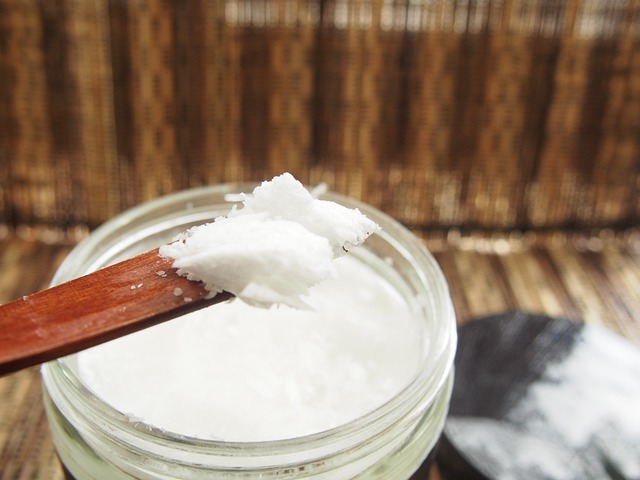Solidified coconut oil on a wooden spoon
