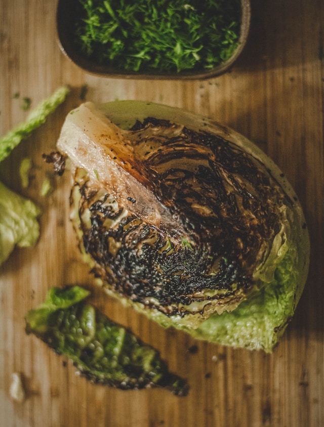 Grilled cabbage on a chopping board
